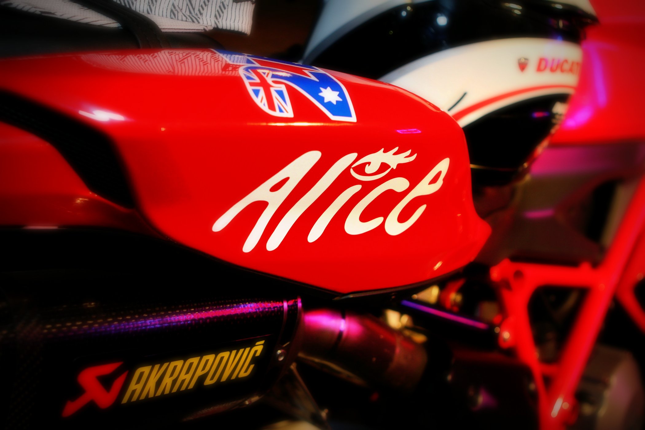 a closeup s of a motorcycle with an allcc sticker on it