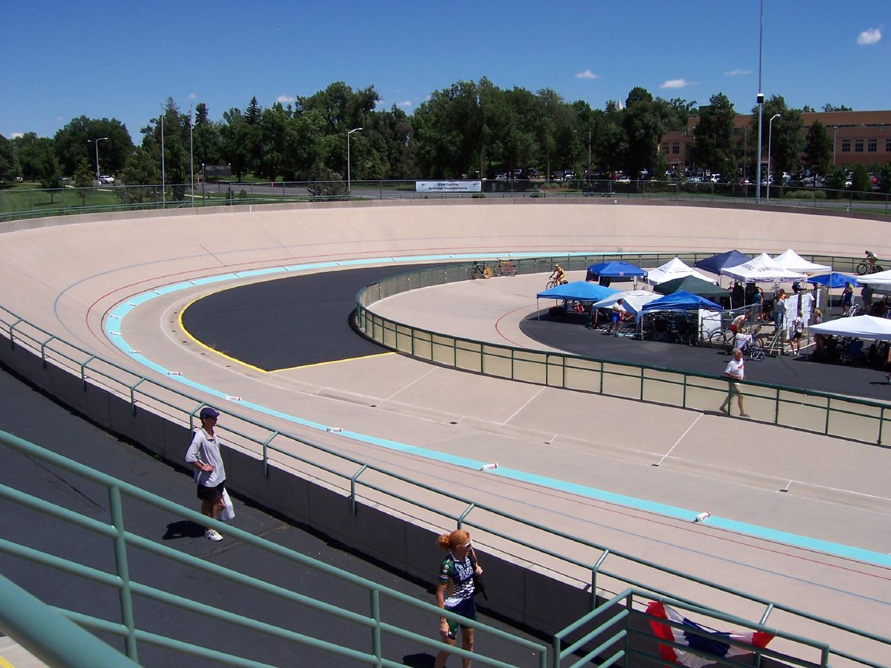 people running around a race track in the middle of a city