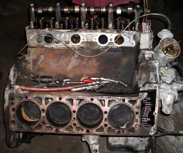 the engine is part of a car with four cylinders