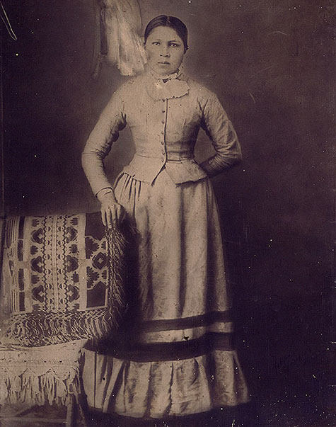 an old po of a woman posing with a basket