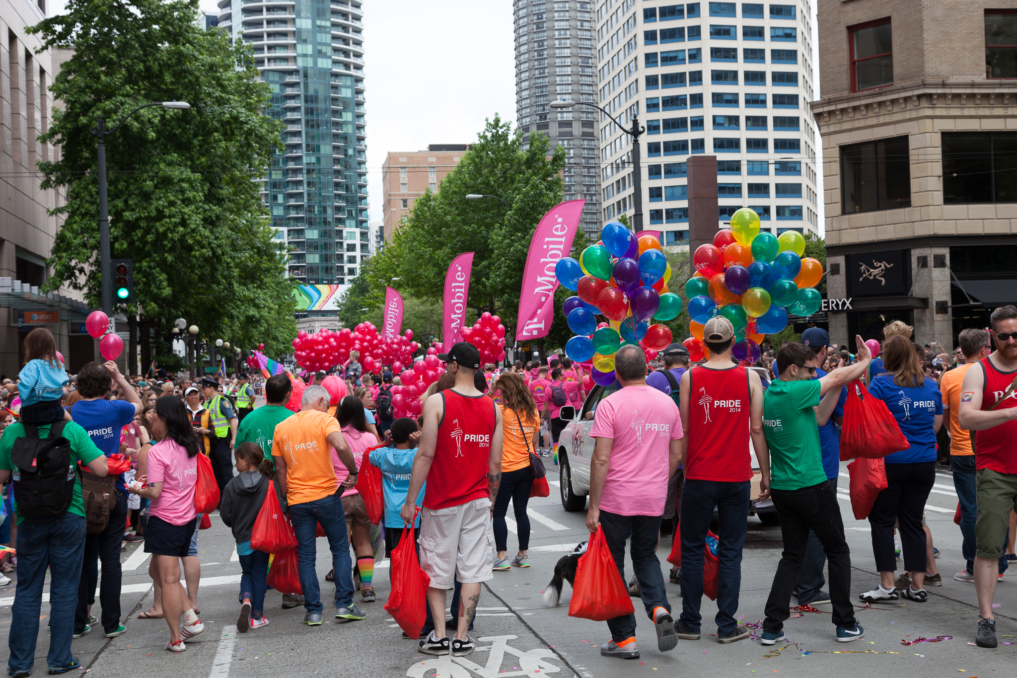 a large group of people walking across a street