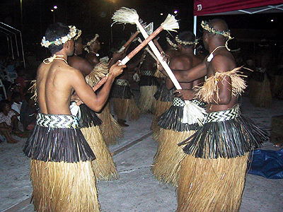 several people in a traditional hawaiian dance