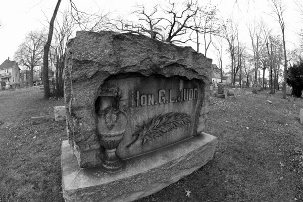 a black and white po of a cemetery stone