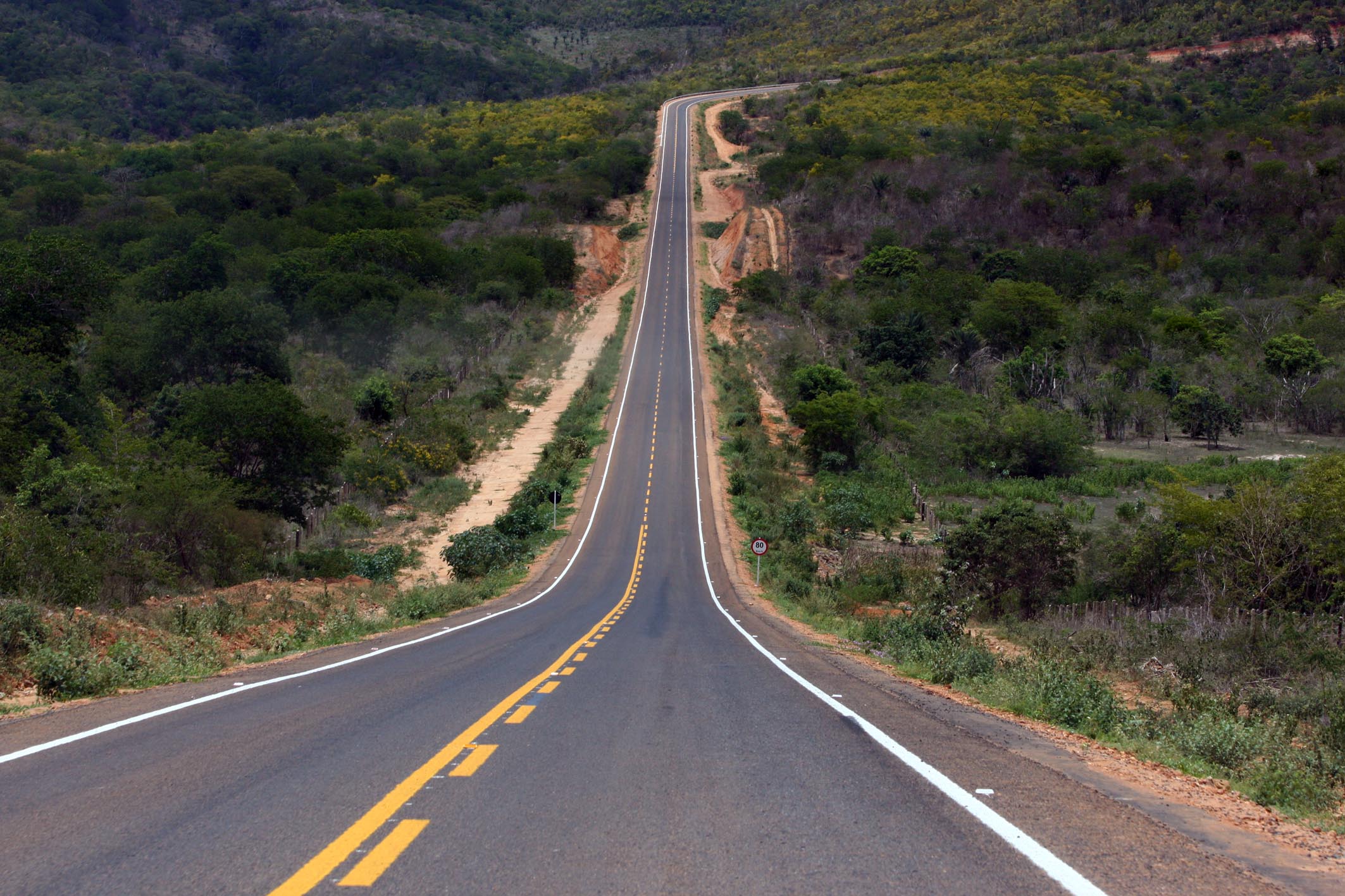 a long straight road in the middle of nowhere