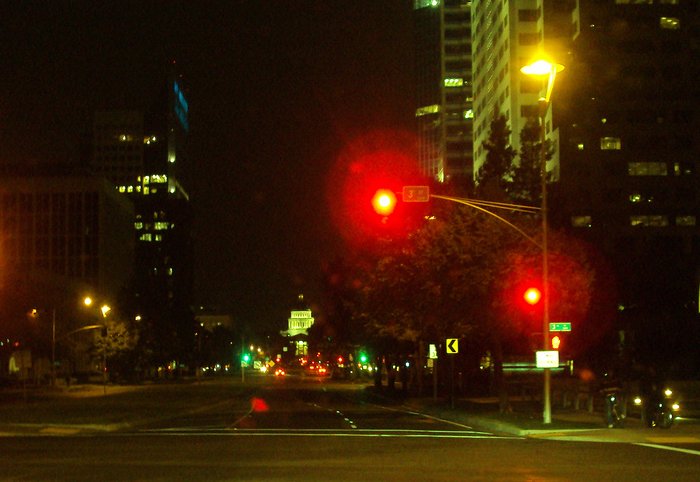 the street lights are red for people to walk on