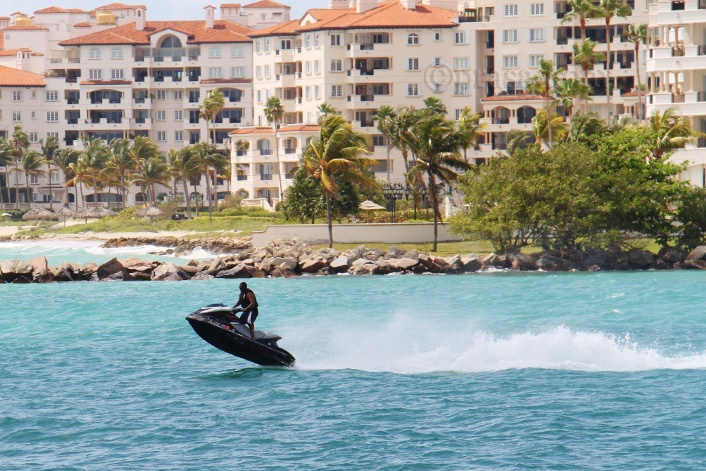 a person is riding on the surfboard in the water