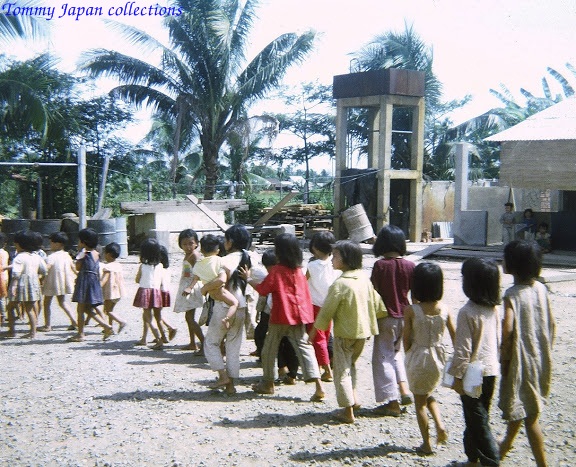 the school children are walking to collect water