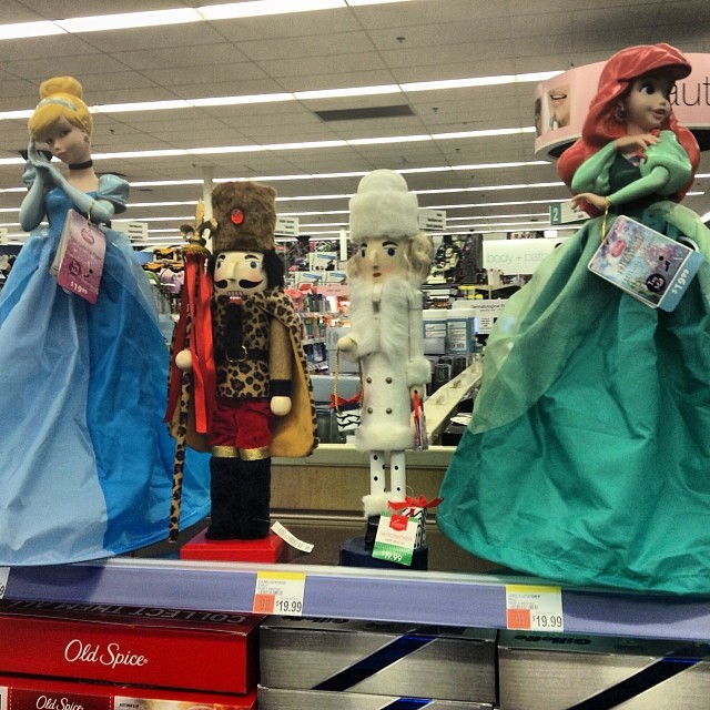 several statues in a store are on display