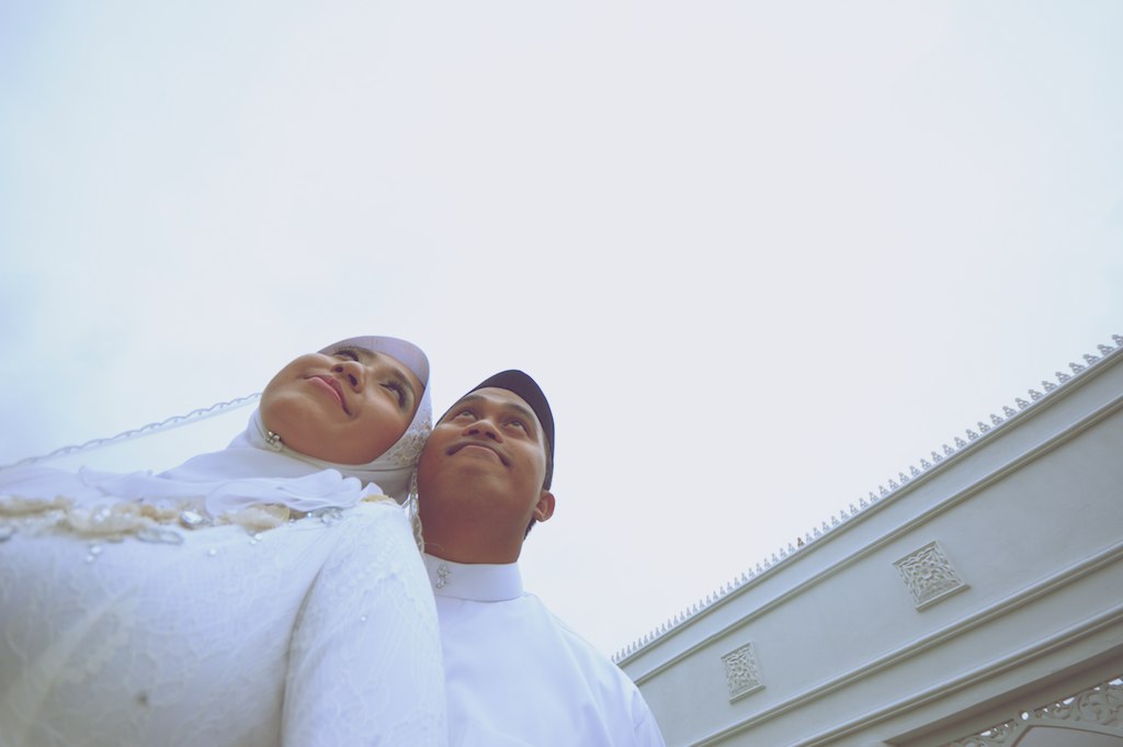 the couple stand together in the middle of the street