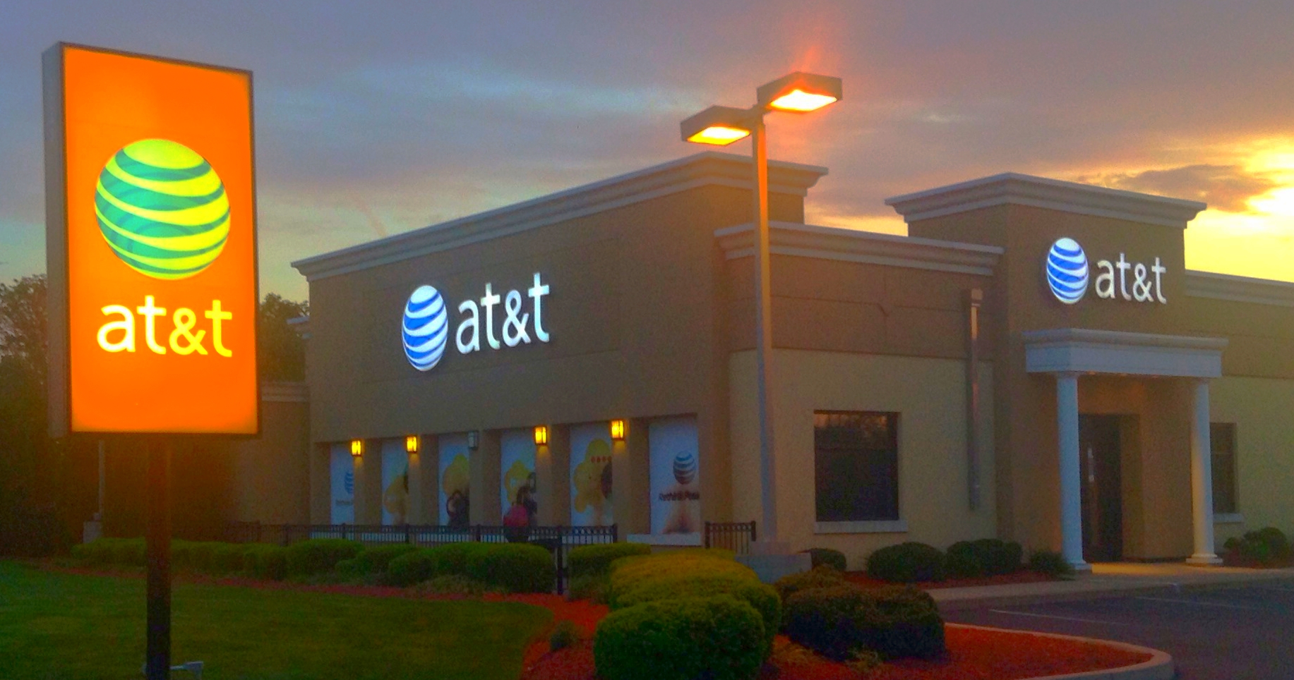 the at & t store with a sign in front