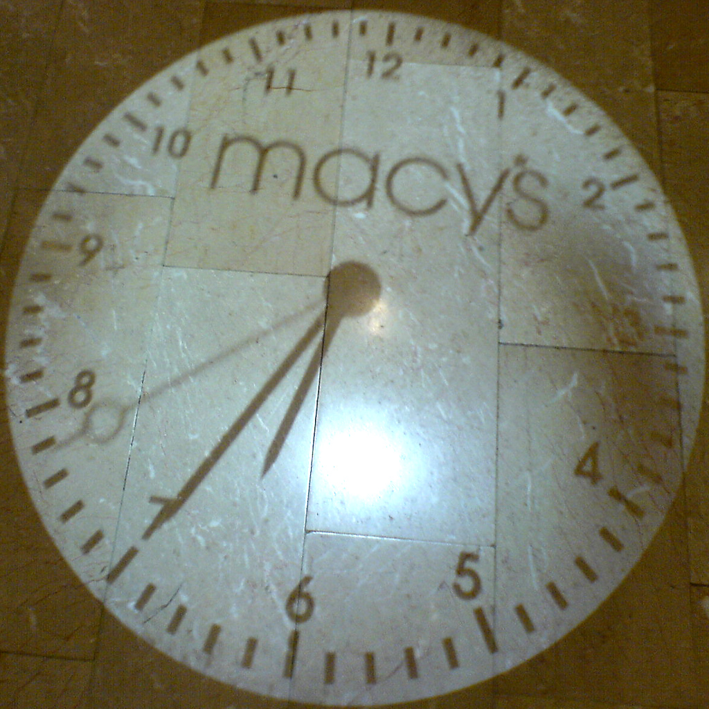 a clock with the names of macy and its time on it