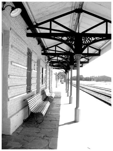 black and white po of benches on train station platform