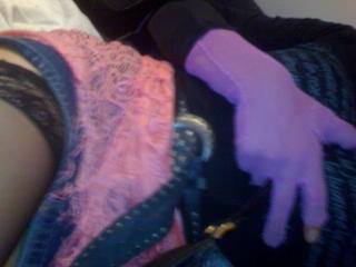 a person that has a pair of purple gloves on