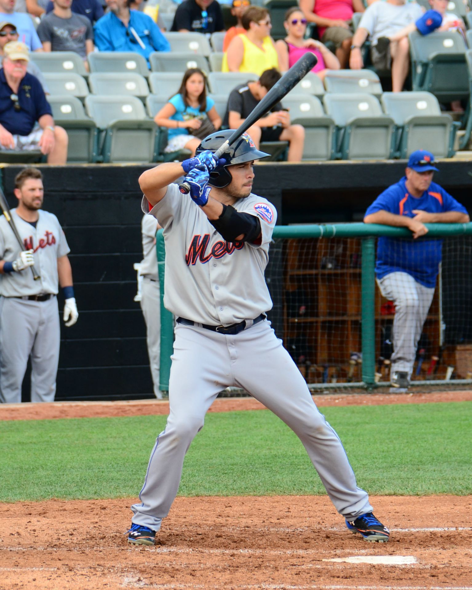 a batter prepares for the next pitch during a game