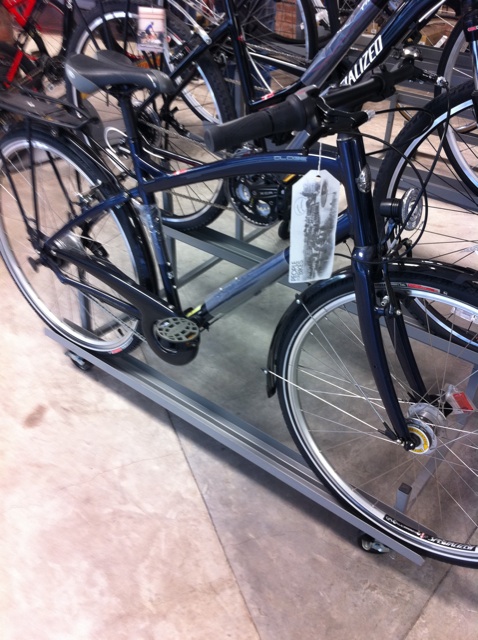 bicycles are in the room with a metal rack