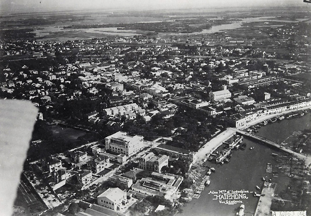 a black and white po of a city and the river