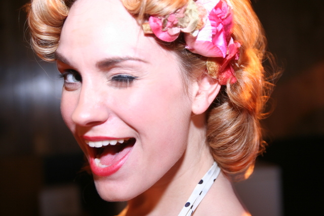 a woman wearing a flower in her hair