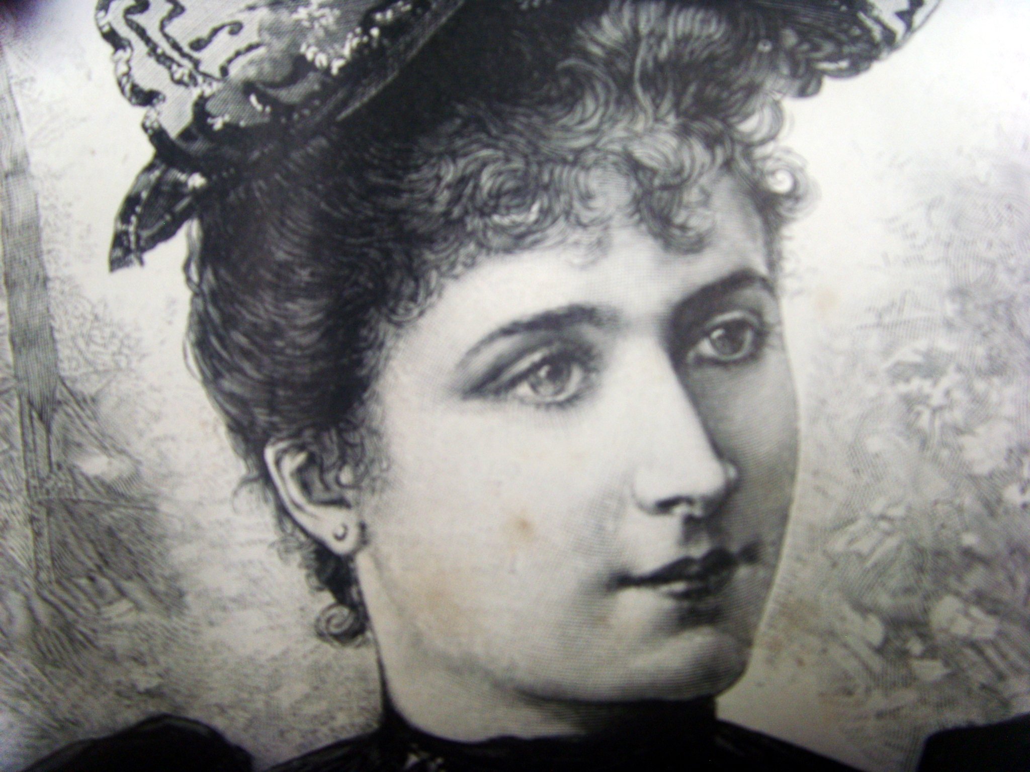 a vintage pograph shows a close - up of the face of a woman