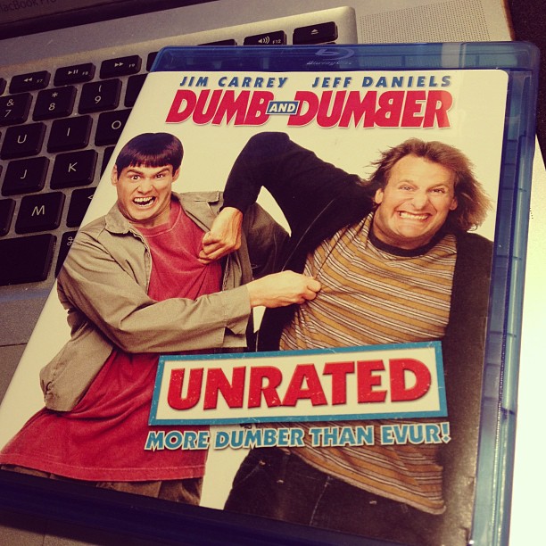 a dvd on a laptop case that has the cover of dumb and dumber on it