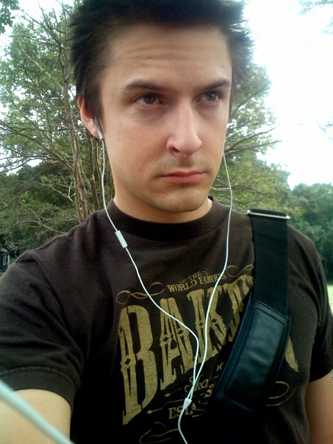 young man with headphones looking into the camera