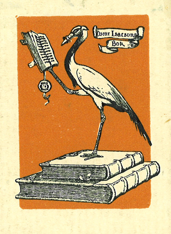 a bird on top of a book next to an open book