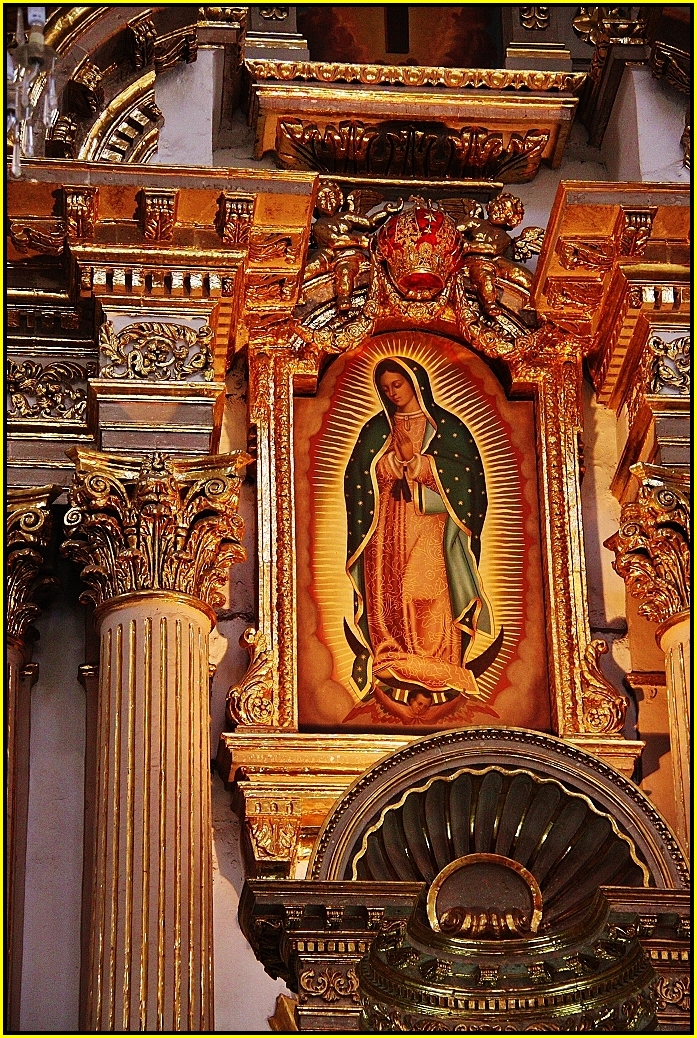 the high altar has a painted religious image