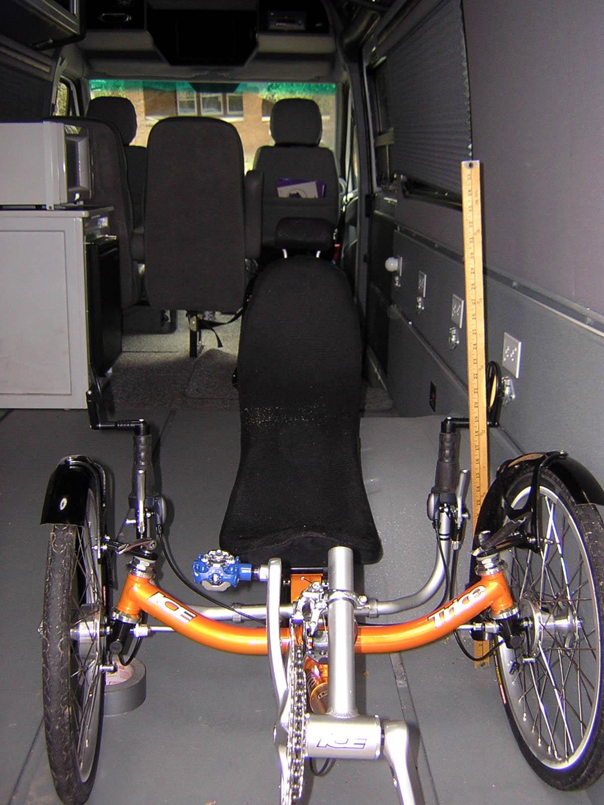 the vehicle has a bicycle attached to the side
