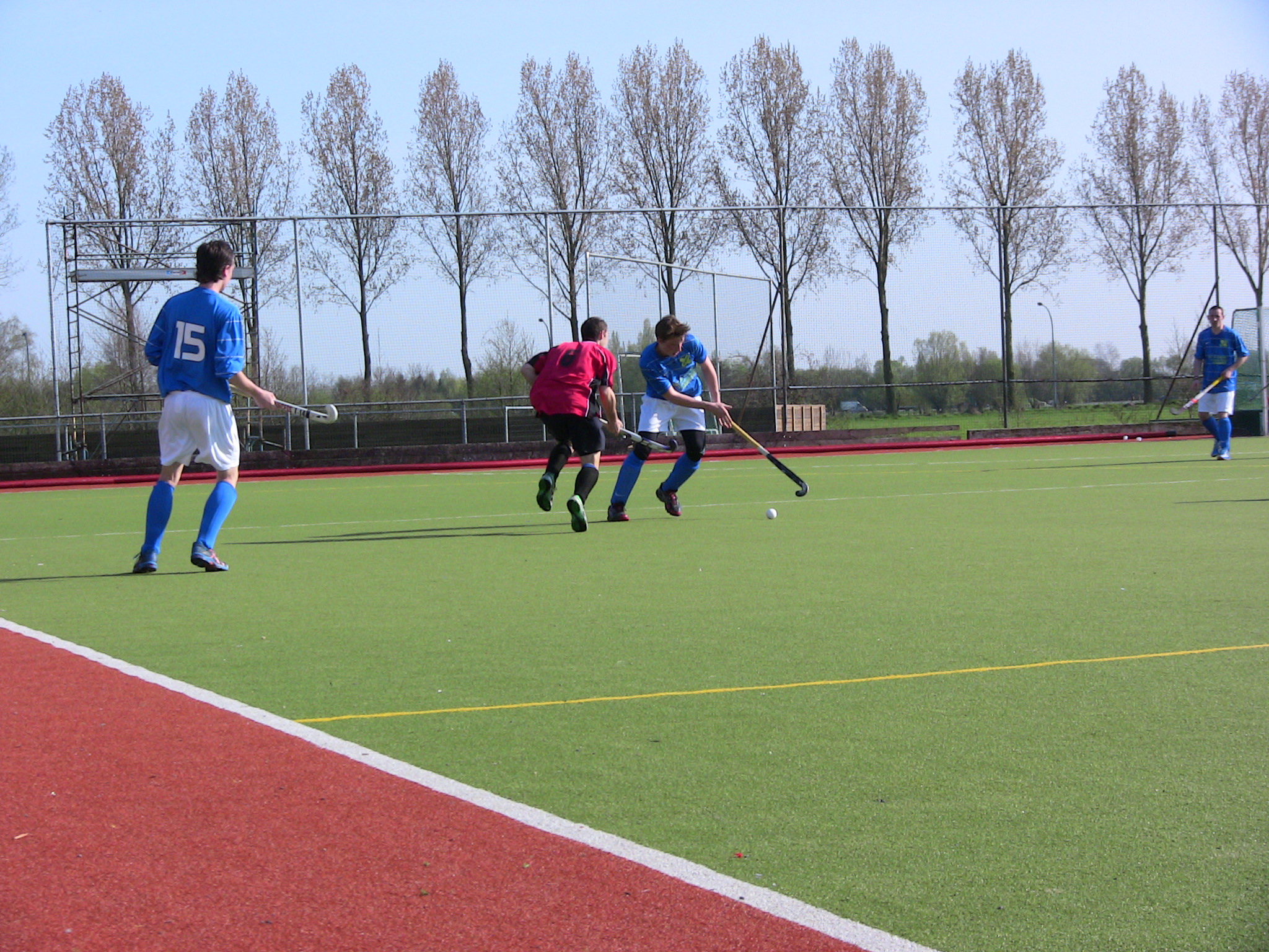 a group of men kicking around a soccer ball