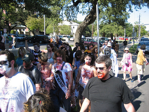 a large group of people are dressed as zombies