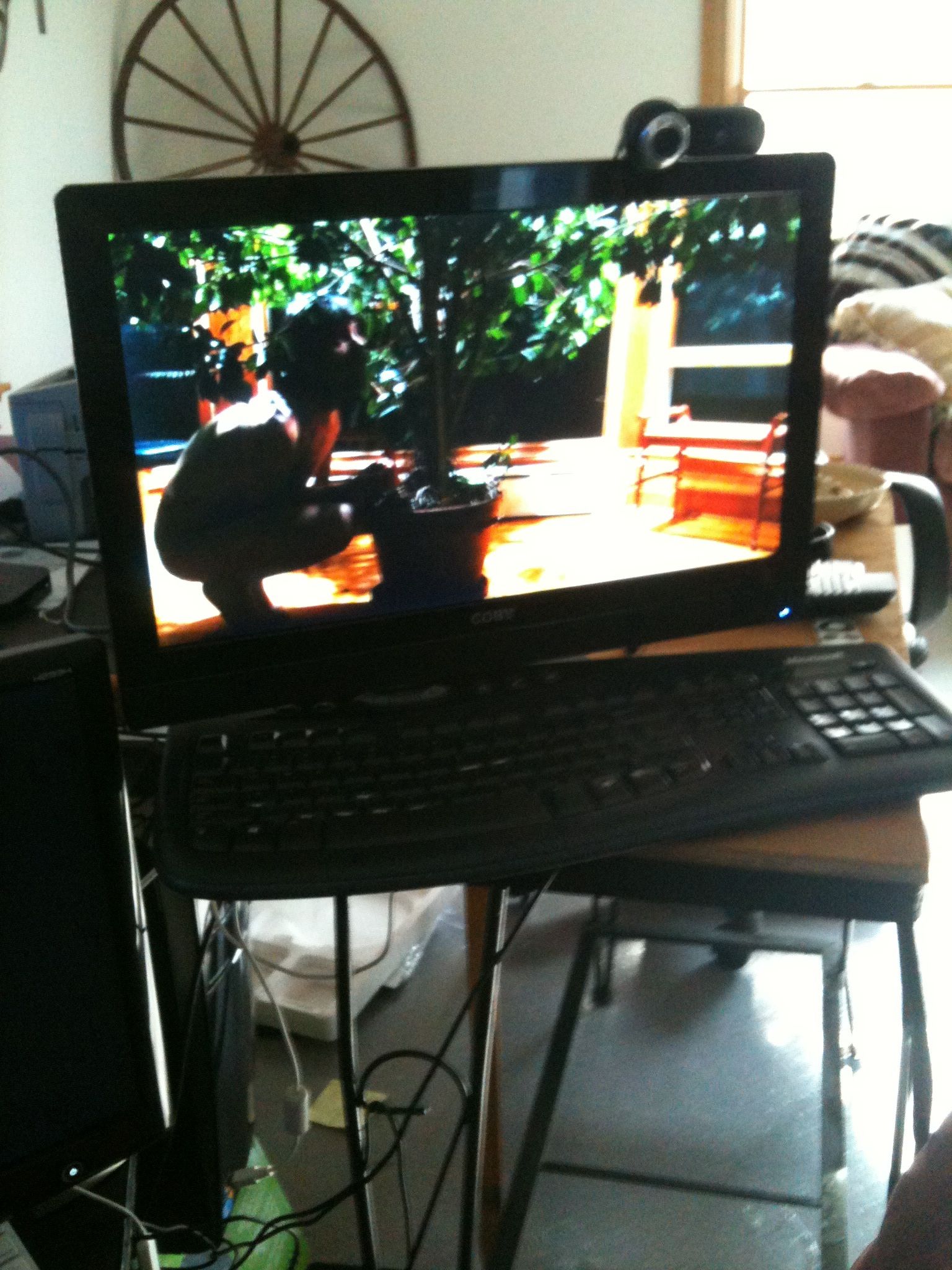 there is a small television monitor being attached to a laptop