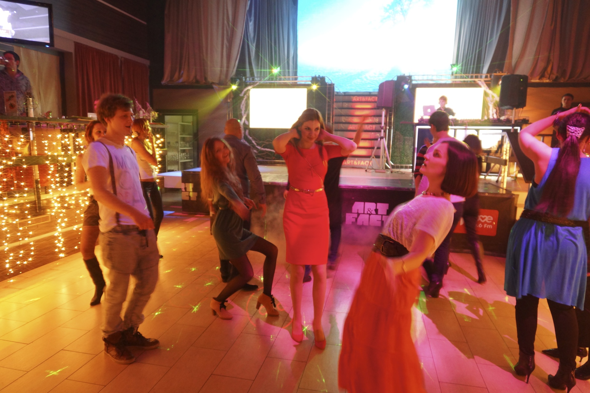 a party on a dance floor with people watching them