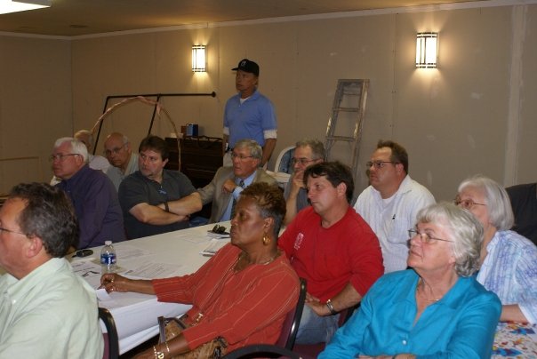 a group of people sitting around a table