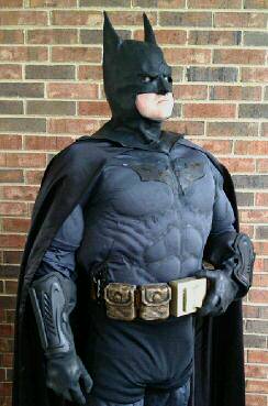 batman costume in black with a tan belt
