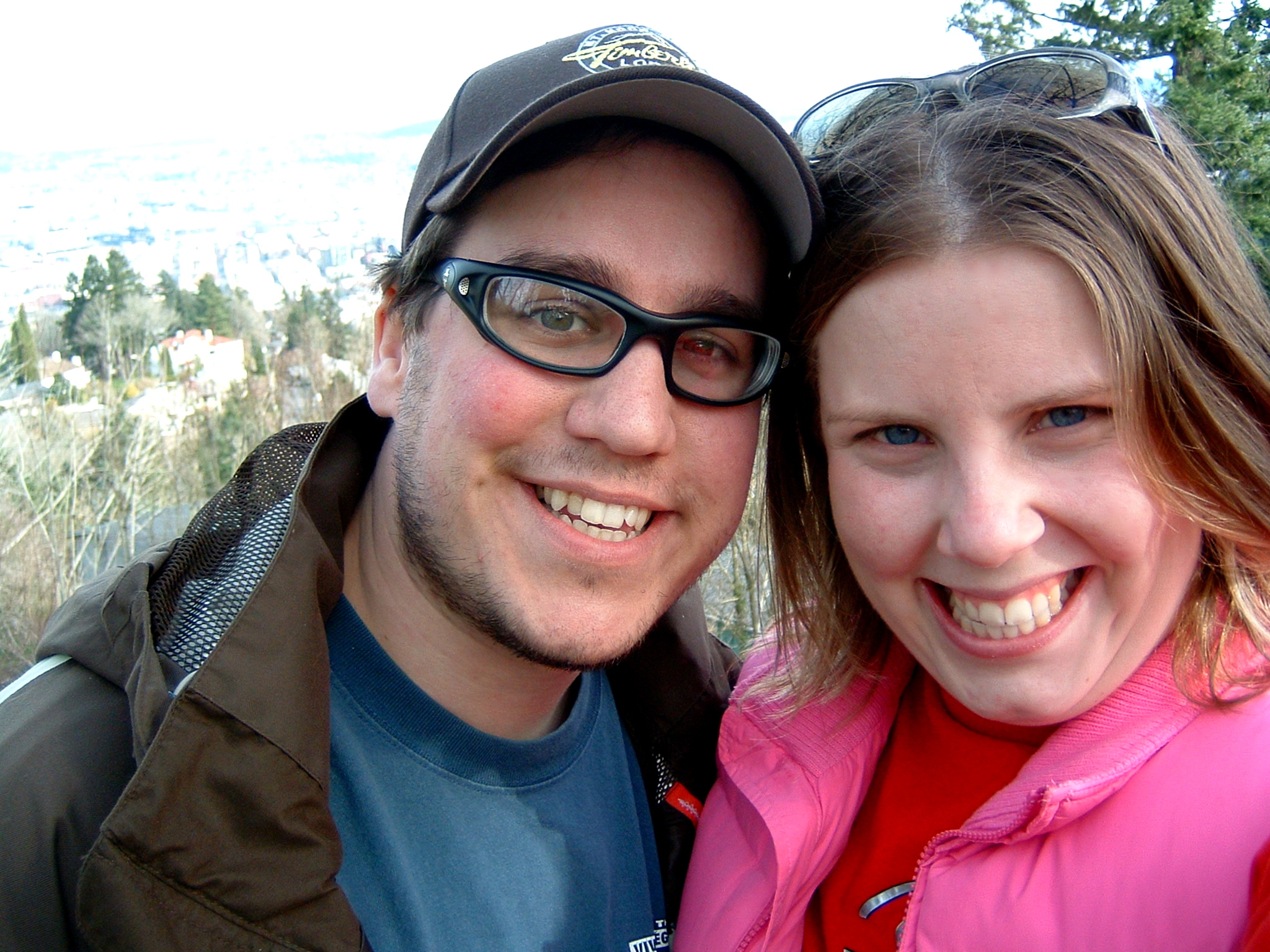 a couple standing next to each other in the wilderness