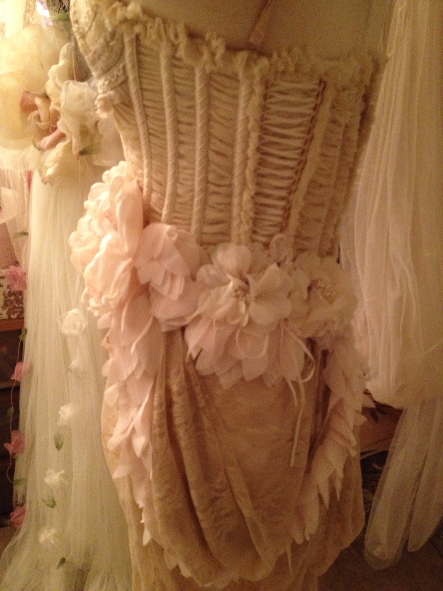 dress in vintage clothing and flowers displayed at shop