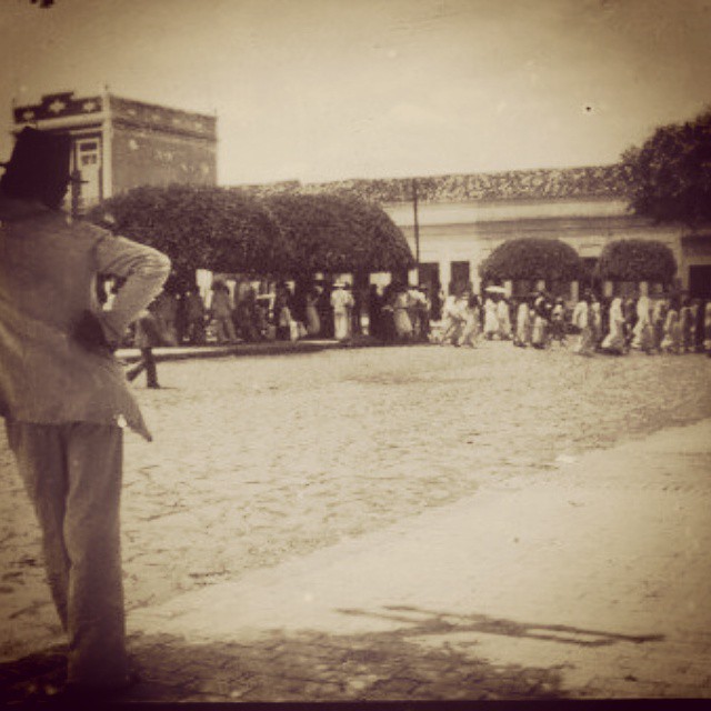 a man is walking in the middle of a large crowd