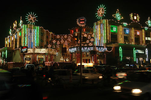 a night scene with a number of buildings lit up and decorated