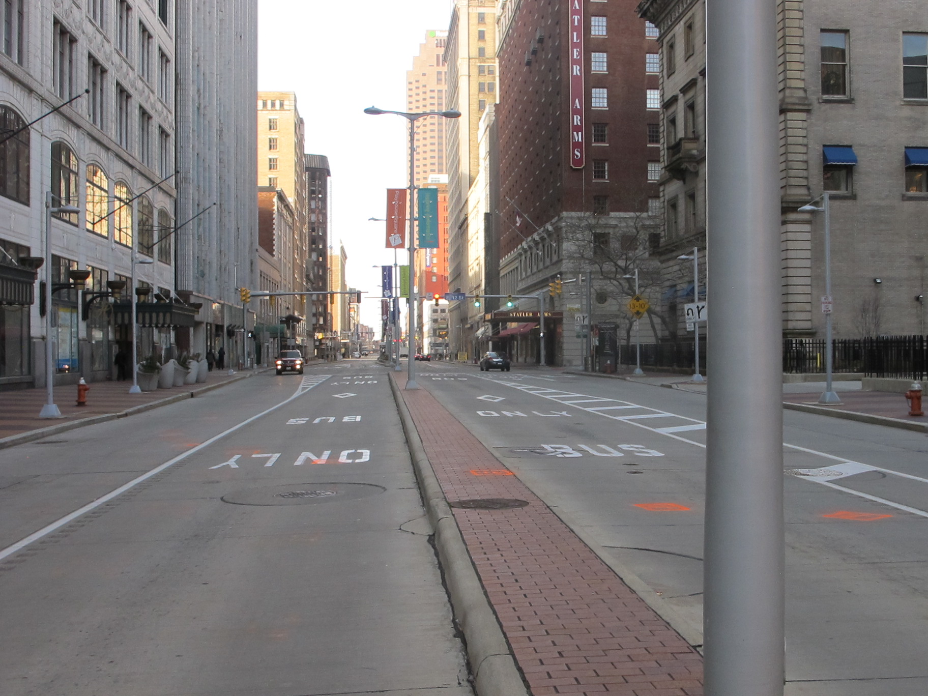 a quiet street in a city with buildings