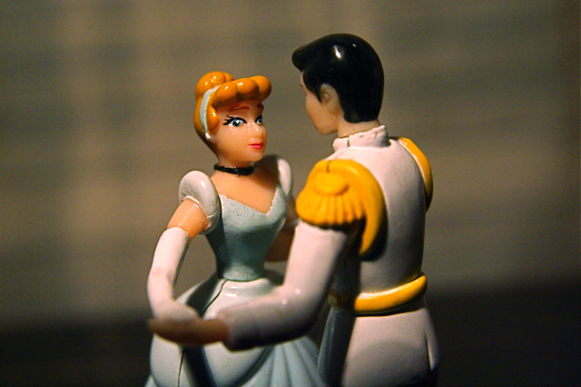 figurine of a man and woman dressed in formal clothing