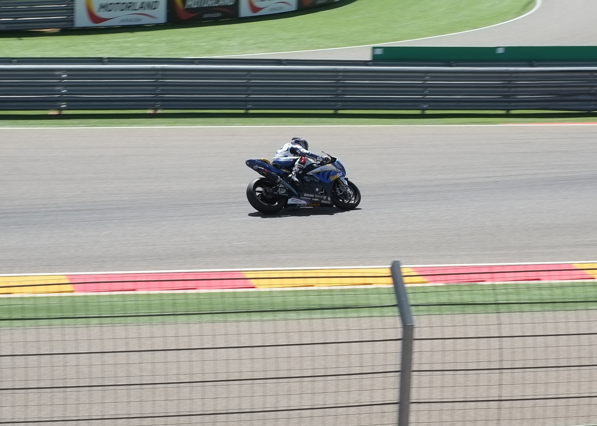 a man riding a motorcycle on a race track