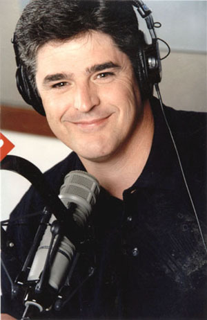 an image of a man smiling wearing headphones with a microphone