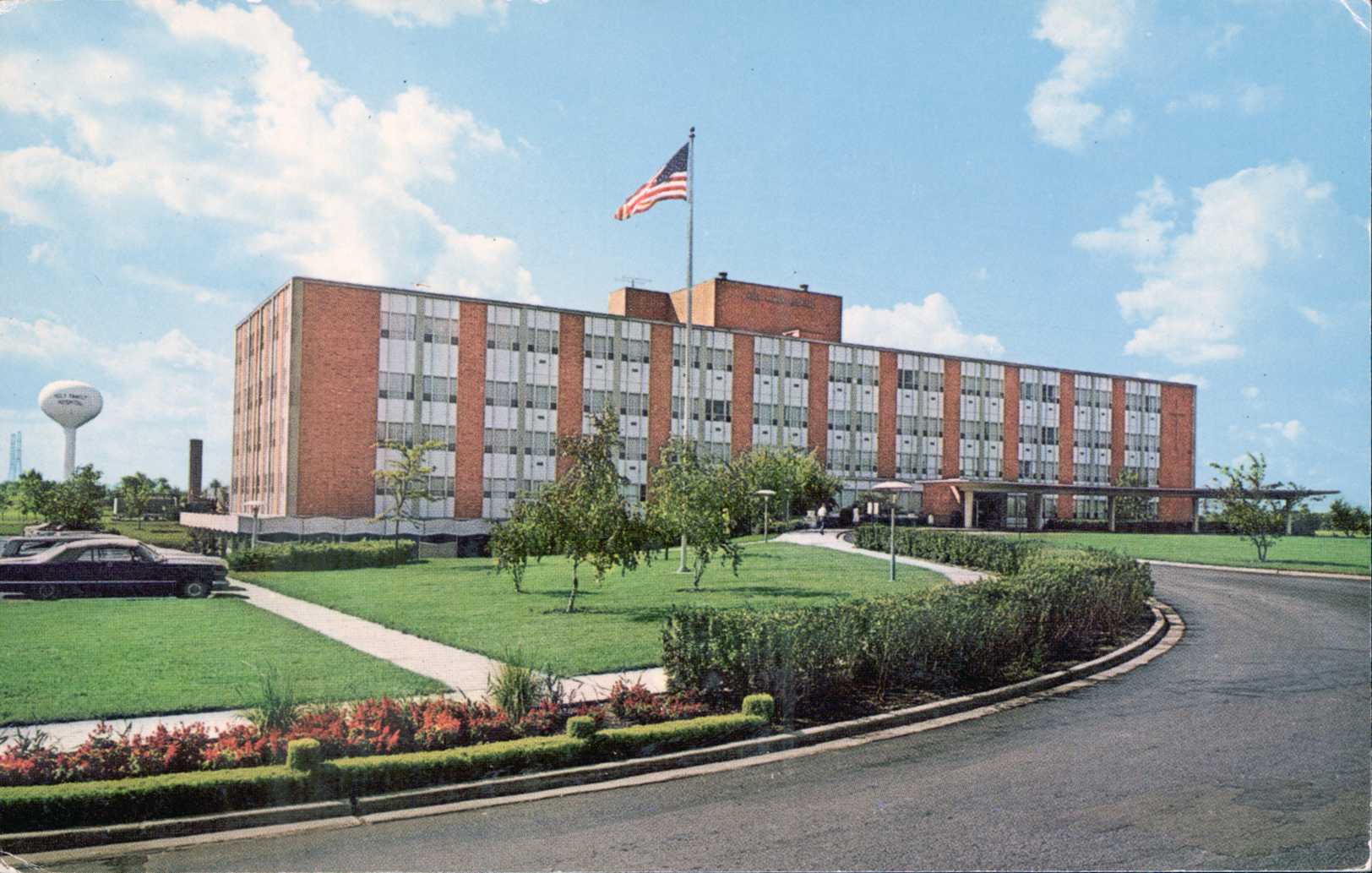 a picture of a large building in a big grassy area