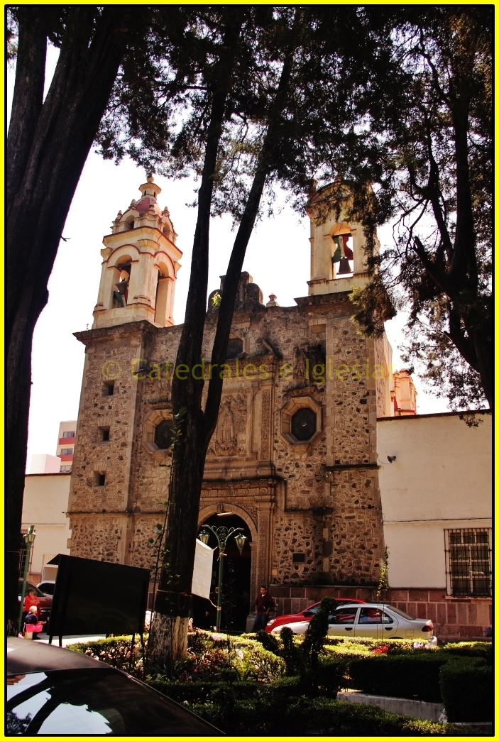 there is a large tall building with two bell towers