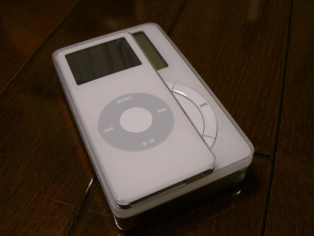a small mp3 player sitting on top of a wooden table