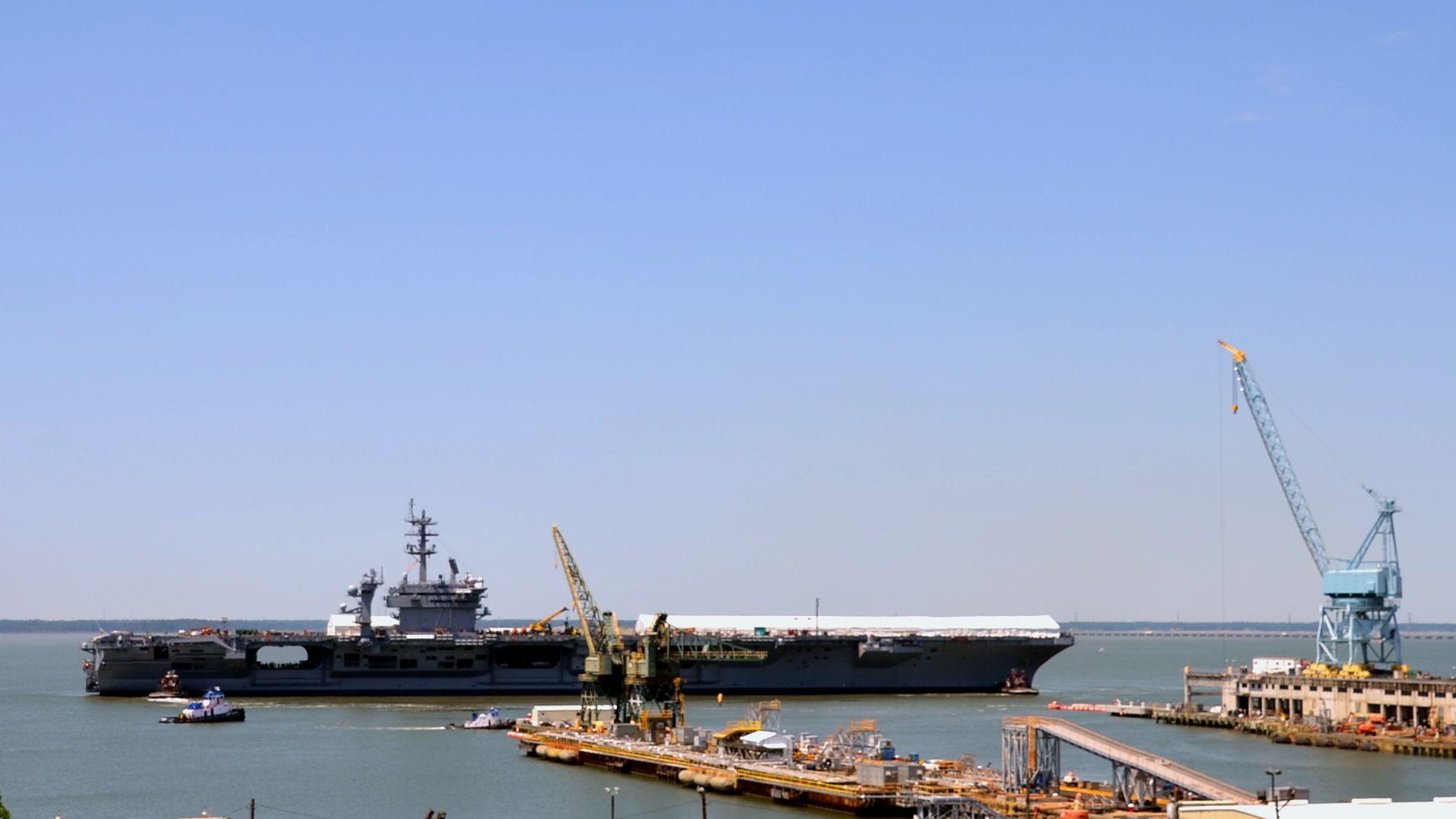 a barge and ship on a harbor filled with water