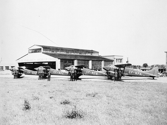 an air plane sitting in front of a building