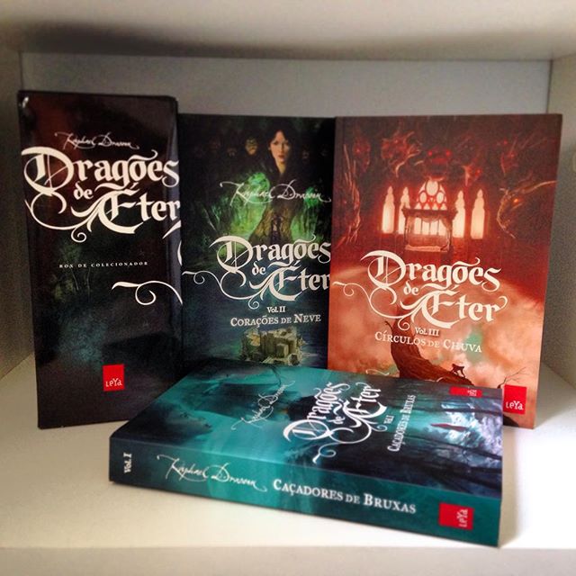 a series of three books, one of which is titled the dragon's heir, on a shelf