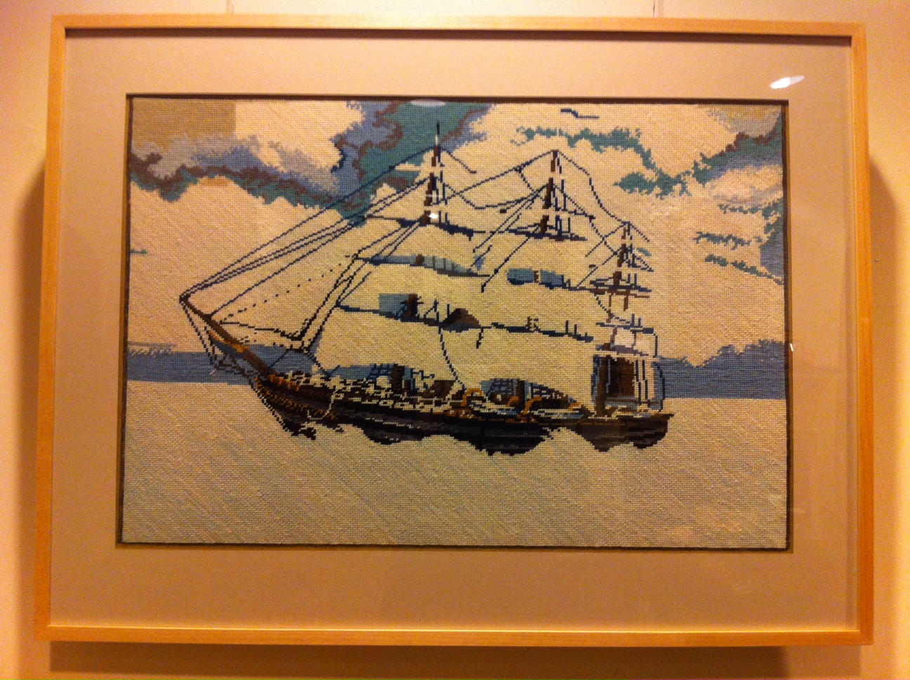 a painting depicting a ship, sitting in the water