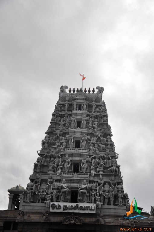 a tower of a temple has sculptures all over it