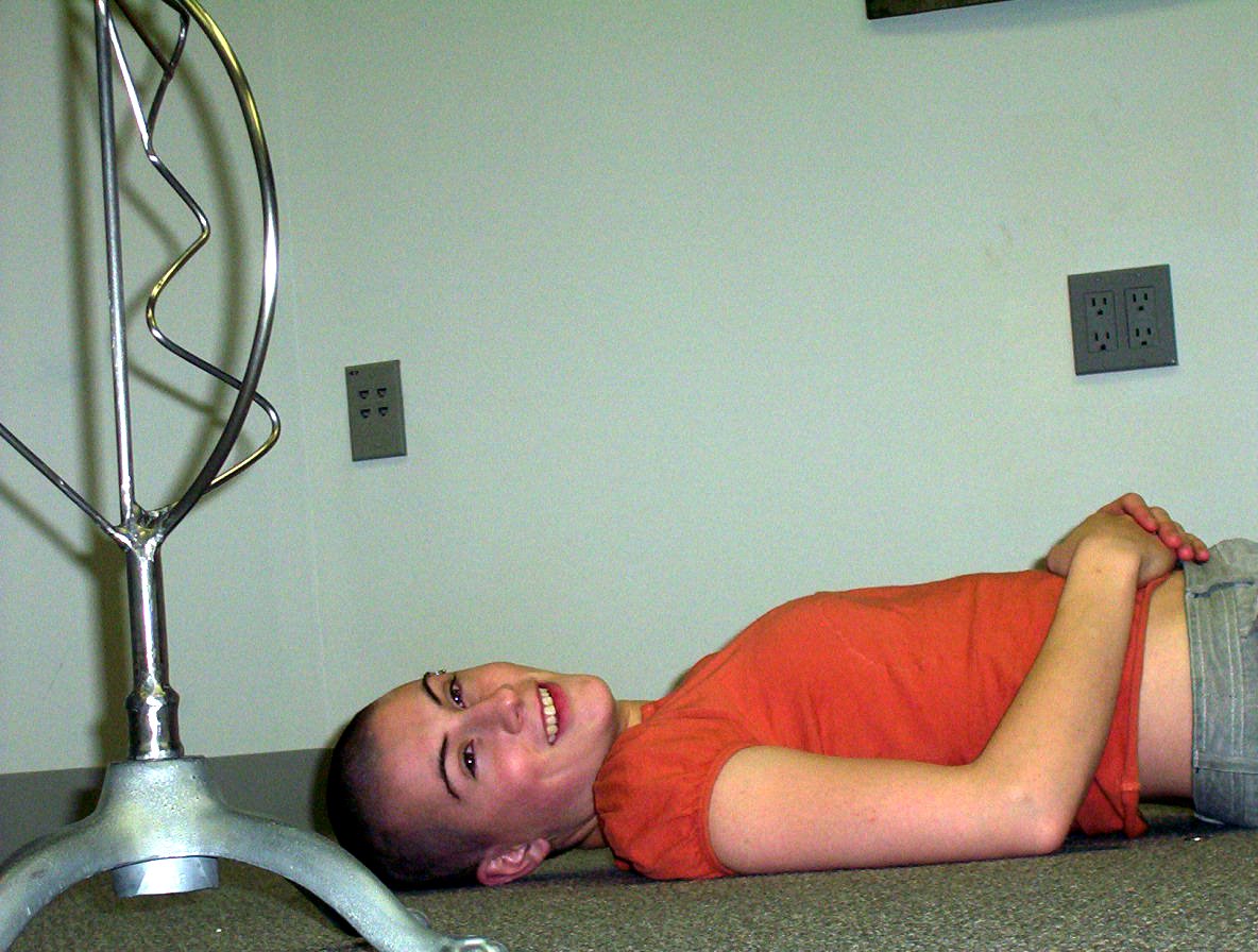a person laying on a surface in a room